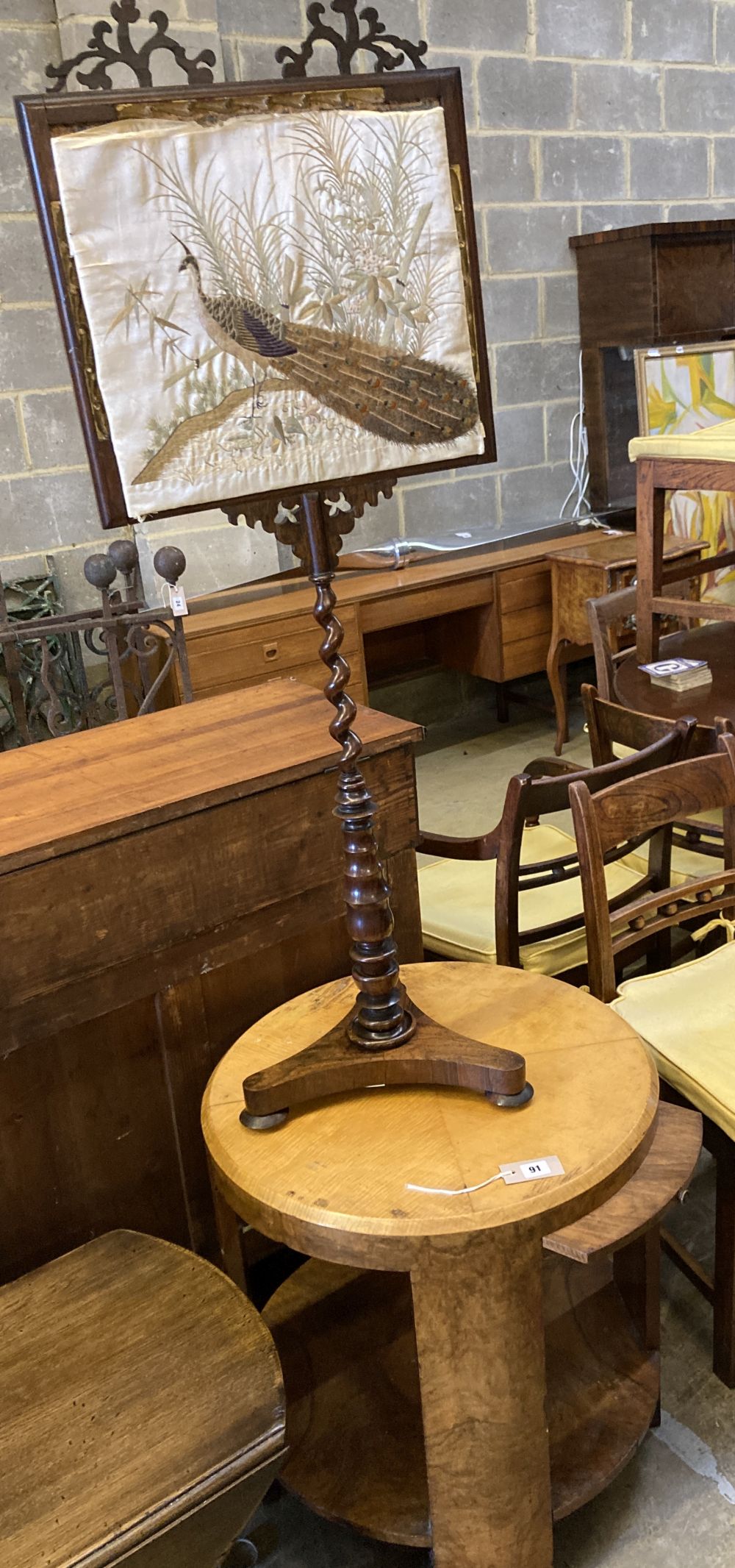 An Art Deco maple and walnut circular two tier table, fitted slides, diameter 60cm, height 62cm together with a Victorian rosewood pole